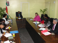 Commissioners Dinah Shelton and Tracy Robinson in a meeting with Edmund C. J. Belfort, Minister of Justice and Police of Suriname.