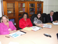 Commissioners Dinah Shelton and Tracy Robinson in a meeting with Stanley Betterson, Minister of Regional Development of Suriname.