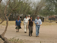 The IACHR delegation walks around the Yakye Axa community